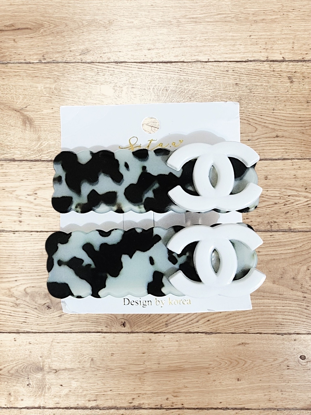 White Interlocking Logo Hair Clips with Black and White Tortoise Pattern